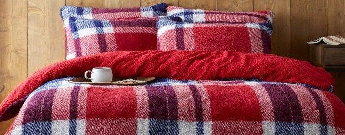 Behold the bold look of the Windsor Check Duvet Cover Set. Featuring a 100% polyester construction in a navy and red check pattern, this set is the perfect way to add a touch of classic elegance to any bedroom. The machine washable construction ensures easy maintenance.
