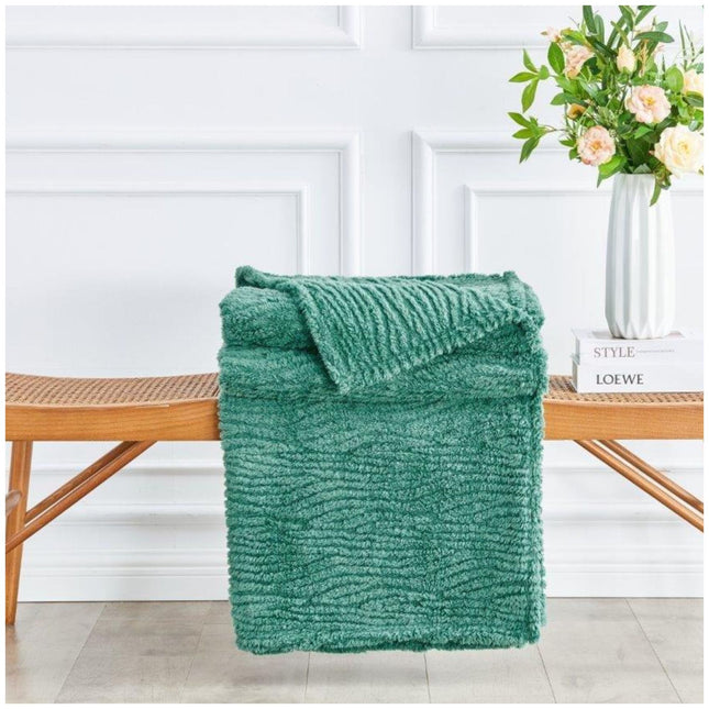 Designed in a versatile charcoal green shade, this blanket complements a variety of interior styles, from earthy and bohemian to sleek and minimalist. Generously sized for double and king-sized beds, it also makes an inviting oversized throw for your sofa or lounging area. The durable, high-quality polyester material is machine washable, fade-resistant, and made for everyday use without compromising on luxury.