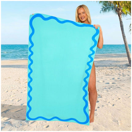 Refreshing aqua beach towel in a simple plain style, made from absorbent microfiber for seaside and vacation adventures.