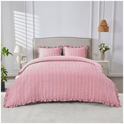 Blush pink seersucker bedding set with soft textured patterns and a delicate, inviting aesthetic.