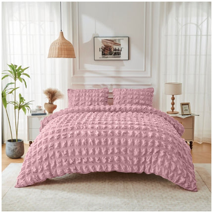 Blush pink duvet set with soft seersucker accents and an elegant, welcoming aesthetic.