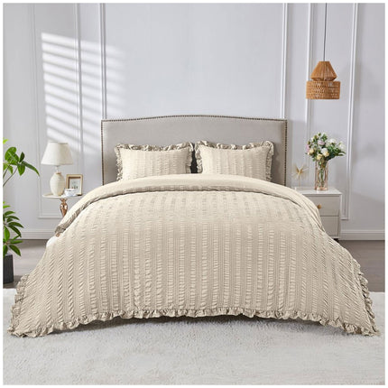 Bone-colored bedding set featuring subtle seersucker detailing and a warm, neutral style for sophisticated interiors