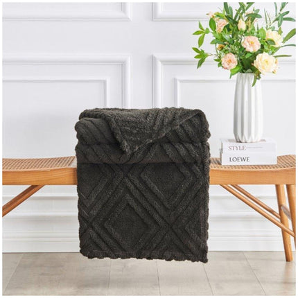 Charmane Jacquard Throw soft woven textured blanket draped over sofa