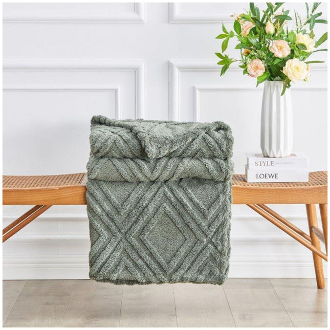 Elegant Charmane Jacquard Throw with intricate pattern on living room couch