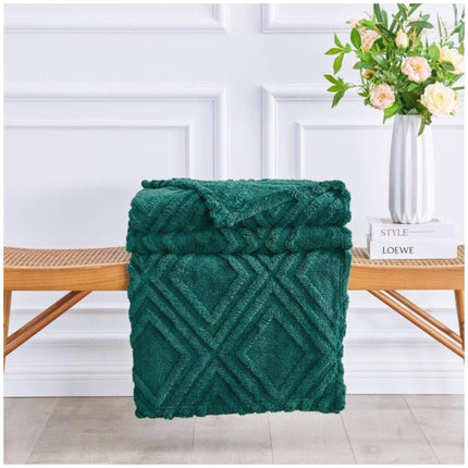 Cozy Charmane Jacquard Throw blanket in neutral tones on armchair