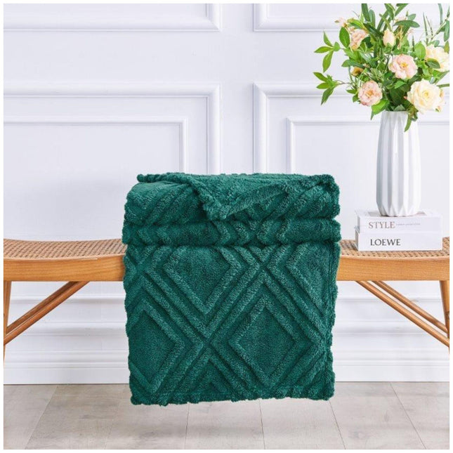 Cozy Charmane Jacquard Throw blanket in neutral tones on armchair