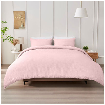 Blush pink Durham bedding set with elegant seersucker detailing and a cozy, modern appearance.