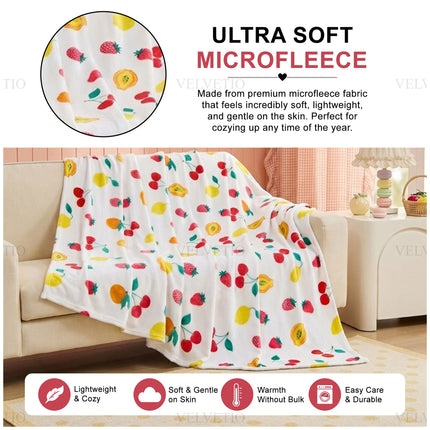 Cosy Fruit Print Floral Blanket – Soft decorative throw featuring an eye-catching botanical and fruit design, perfect for keeping warm while bringing a cheerful, colourful and inviting look to your home interior.