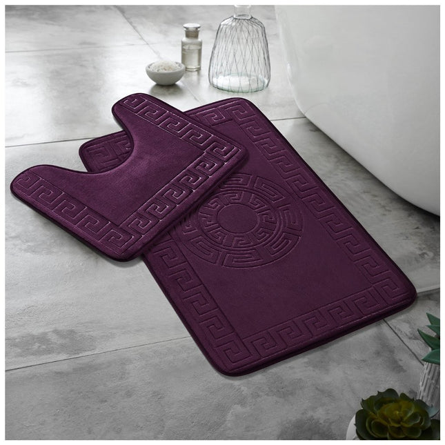 This image features two striking purple bathroom rugs that blend timeless design with modern functionality. The larger rug is rectangular, showcasing an elegant Greek key border that gracefully frames a central circular design, evoking classical motifs reinterpreted for contemporary decor. In contrast, the smaller rug boasts a U-shaped cutout, meticulously designed to fit around the base of a toilet while mirroring the ornate Greek key pattern for a harmonious and cohesive look.