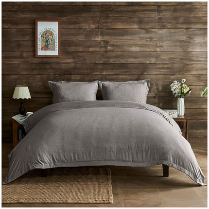 Grey Signature Newry bedding set showcasing refined texture and timeless minimalist design elements.