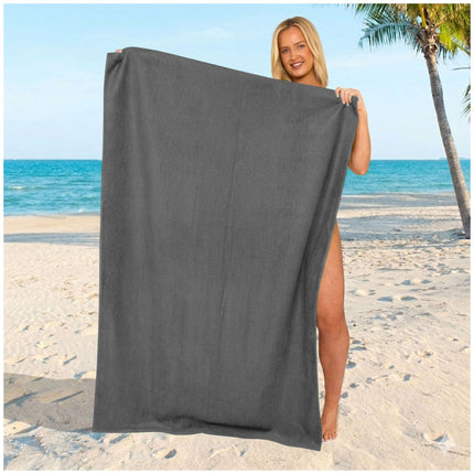 Contemporary grey beach towel with a neutral solid finish and an elegant minimalist appeal.