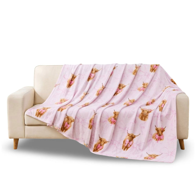 Highland Cow With Bow Throw Blanket – Soft and cosy decorative home blanket featuring an adorable Highland cow with a charming bow detail, perfect for adding warmth, comfort and countryside character to sofas, beds and chairs.