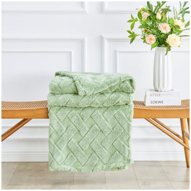 On the reverse side, a thick Sherpa fleece lining adds another dimension of warmth, making this blanket perfect for cold winter nights or simply lounging in ultimate comfort. What truly sets this throw apart is its elegant jacquard embossed design, blending timeless sophistication with subtle texture that enhances the visual appeal of any bedroom or living space