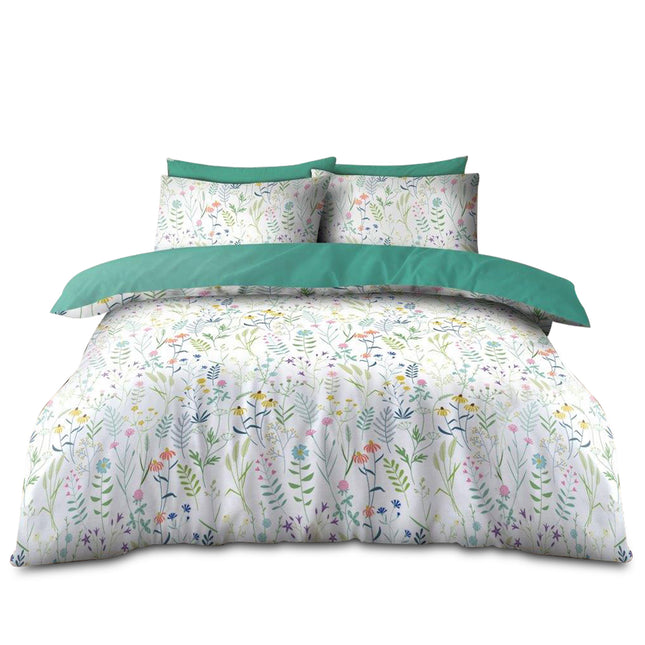 This meadow duvet set exudes an ethereal charm reminiscent of a sunlit wildflower meadow. The crisp white base is playfully adorned with vibrant wildflowers rendered in shades of soft pink, gentle yellow, tranquil blue, and lush green, each petal and leaf capturing nature’s fleeting beauty. A bold solid green border elegantly frames the design, emphasizing the harmonious interplay of color and form while adding a touch of rustic sophistication. The high-quality, 