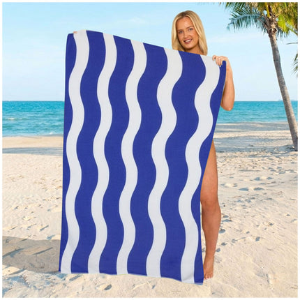 Elegant navy wavy stripe towel crafted from lightweight microfiber, ideal for beach holidays and poolside comfort.