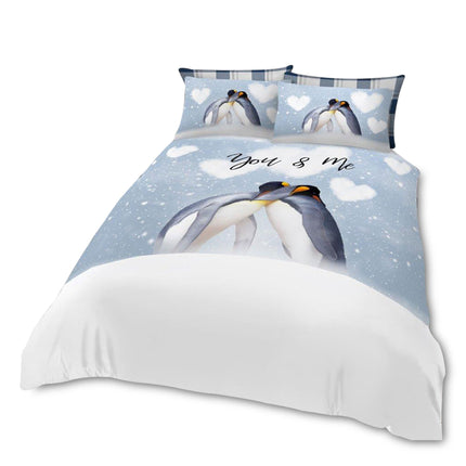 Celebrate love and coziness with this charming "You & Me" Penguin Duvet Cover Set, featuring an adorable pair of penguins cuddling under a snowy sky with heart-shaped clouds. Soft and romantic, this winter-inspired bedding adds a sweet, cozy touch to any bedroom, making it perfect for couples or as a thoughtful gift for someone special.