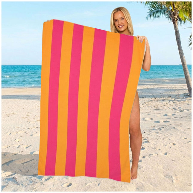Vibrant pink striped beach towel made from smooth absorbent microfiber, perfect for poolside lounging and summer vacations.