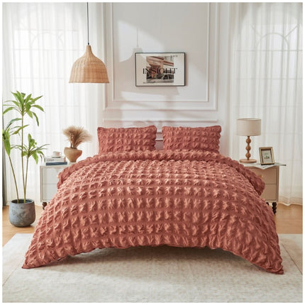 Warm rust-coloured duvet set with distinctive seersucker texture, adding richness and character to modern interiors.