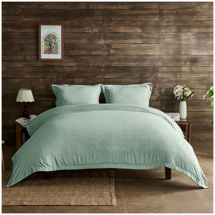 Signature Newry bedding set in sage green featuring textured seersucker fabric and a calming contemporary style.