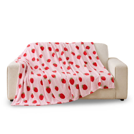 Strawberry Flannel Throw featuring a charming fruit-inspired pattern, ideal for styling sofas, beds, armchairs and cosy living spaces with a playful decorative accent.
