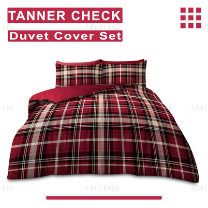 The image spotlights the TANNER CHECK Duvet Cover Set by VELVETIO, immediately drawing attention with its bold checkered pattern in striking red, black, and white. The product name is prominently featured at the top, firmly establishing the identity of this modern bedding set. The duvet cover and matching pillowcases boast a classic, yet contemporary plaid design that balances timeless appeal with an engaging visual energy.