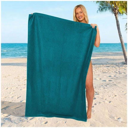Modern teal oversized towel featuring a sleek solid design and a smooth, lightweight texture.
