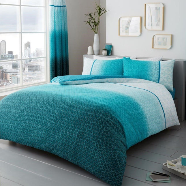 Brighten your bedroom with the refreshing look of the PRINTED Urban Ombre Duvet Cover Set in Aqua, featuring a stunning gradient that transitions from deep turquoise to crisp white, accented by a subtle geometric pattern. Reversible for added versatility, this modern bedding set is made from soft, breathable microfiber to keep you comfortable in every season. Ideal for contemporary spaces or anyone seeking a cool, calming aesthetic, each set includes matching pillowcases and is available in all sizes       