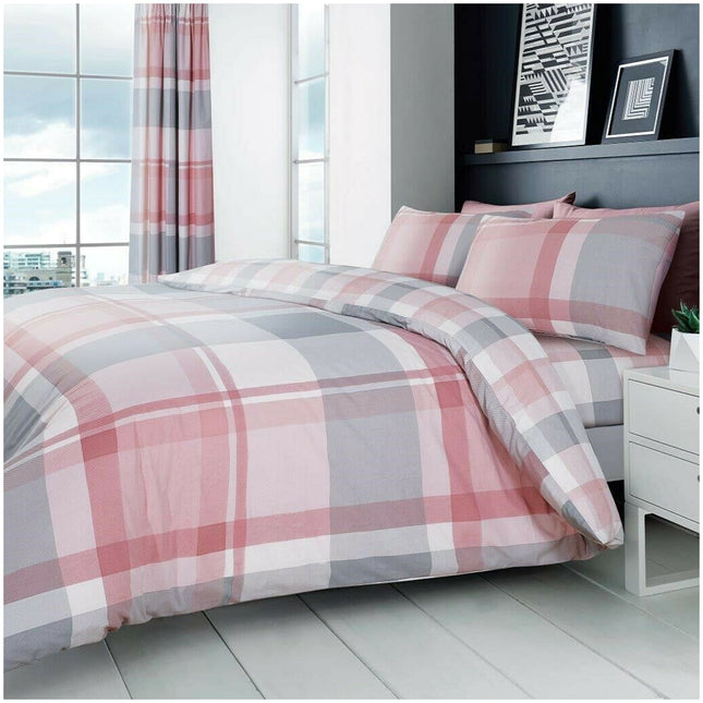 Add a touch of modern charm to your bedroom with this Printed Waverly Check Duvet Cover Set in soft pink and grey tones. The reversible design offers two contemporary looks in one, making it easy to refresh your space. Crafted from a cozy and durable 50% cotton, 50% polyester blend, this set includes matching pillowcases and is both breathable and easy to care for—ideal for everyday comfort with effortless style.