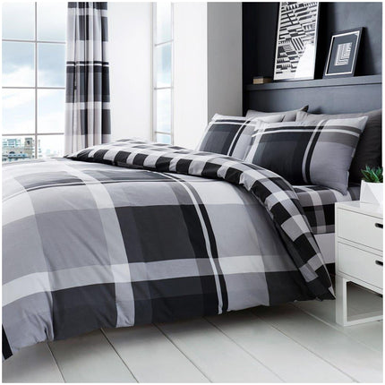 Bring bold sophistication to your bedroom with this Printed Waverly Check Duvet Cover Set in striking monochrome tones. Featuring a reversible design for versatile styling, this bedding set is made from a comfortable and durable 50% cotton, 50% polyester blend. The matching pillowcases complete the coordinated look, while the breathable, soft-touch fabric ensures a restful night's sleep. Perfect for modern interiors, it’s also easy to care for—just machine wash and relax.