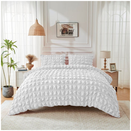 Modern Signature Ripon duvet set in crisp white with elegant seersucker detailing and a bright, airy bedroom feel.
