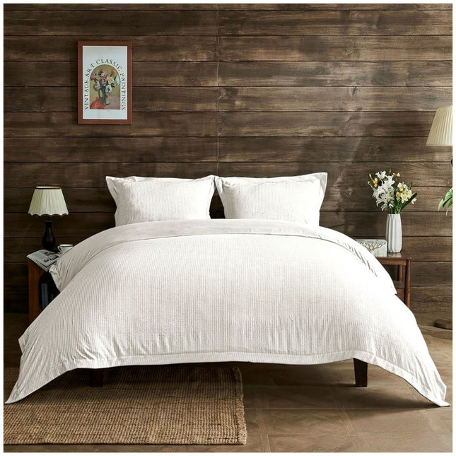 White Signature Newry duvet cover set with a delicate seersucker pattern and a fresh, elegant bedroom appearance.