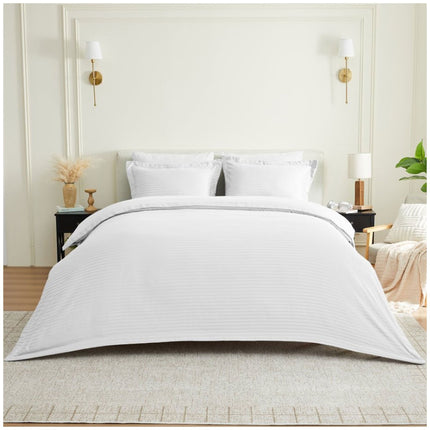 Pure white Oxford seersucker duvet cover set with delicate textured stripes, creating a fresh and elegant bedroom aesthetic.