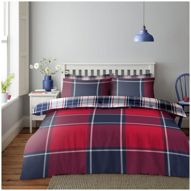 Add a bold and stylish touch to your bedroom with this Reversible Check Pattern Duvet Cover Set in Red and Navy, featuring a vibrant tartan design that brings warmth and character to any space. The reversible design offers a fresh alternative look with a crisp check pattern on the other side, allowing you to switch up your décor in seconds. Made from soft, easy-care microfiber, this bedding set ensures cozy comfort and effortless maintenance.