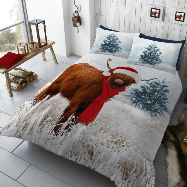 Add a rustic holiday charm to your bedroom with the Winter Highland Cow V2 Xmas Duvet Cover Set. Featuring a festive Highland cow dressed in a Santa hat and red scarf, this cozy bedding set brings warmth and humor to your Christmas décor. Surrounded by snowy fir trees and frosted grass, the detailed winter landscape print creates a perfect seasonal scene.
