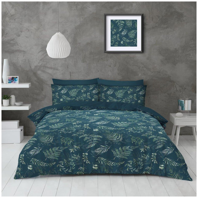 Wrapped in a rich dark teal, this bedding set brings an earthy sophistication to any bedroom, adorned with a lush botanical print of ferns and leaves in refreshing greens. Set against a minimalist grey backdrop and framed with modern white accents—from the pendant light to the clean lines of the furniture—it strikes a beautiful balance between natural tranquility and urban chic. The matching wall art and playful shelf decor subtly echo the bedding’s design, creating a cohesive,