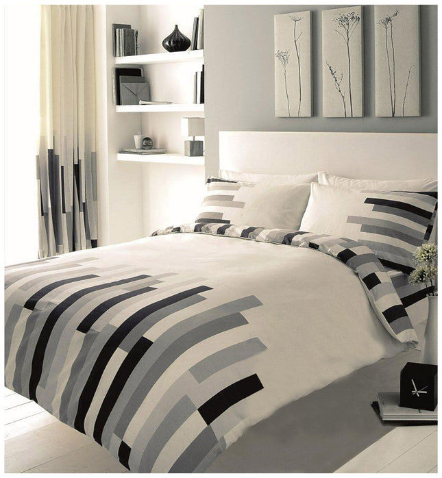 This luxurious BLOCKS Duvet Cover Set features a unique and stylish black, cream, and grey color combination. Crafted with high-quality 50% polyester and 50% cotton, this set is soft, lightweight for all-night comfort. Enjoy a warm and cozy night's sleep with this must-have bedding set.